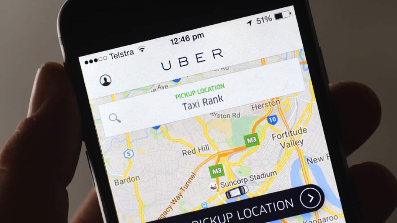 An Uber app is seen on a mobile phone