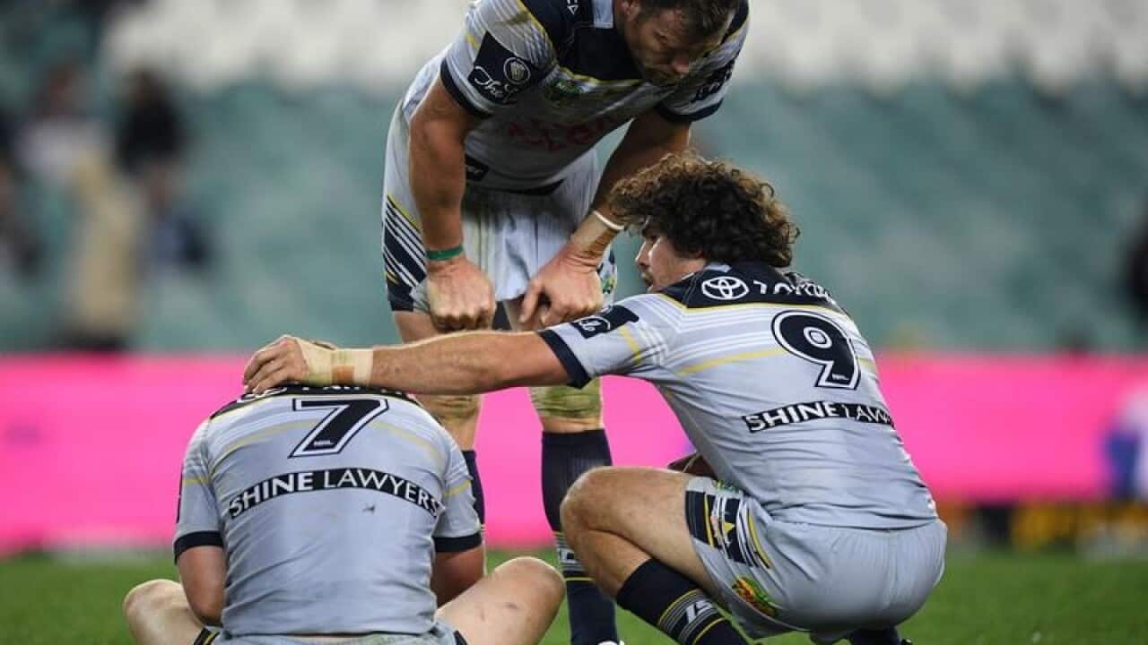 Dejected Cowboys players.