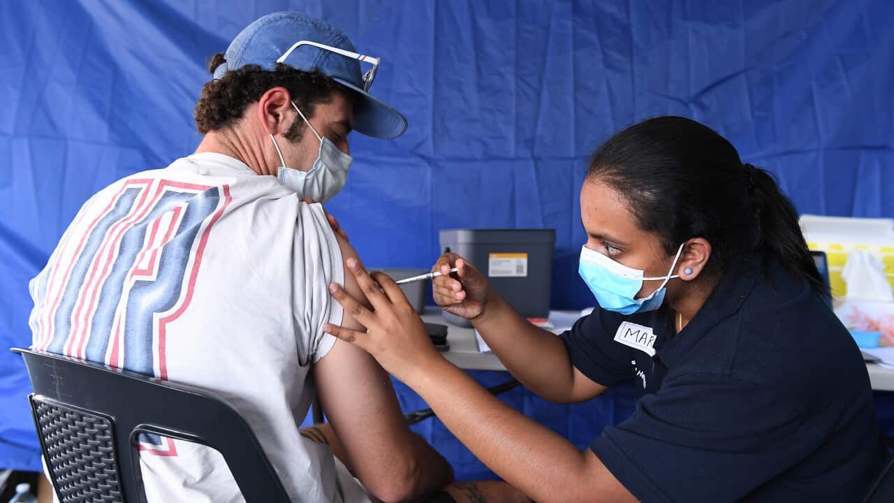 A man receiving a vaccination