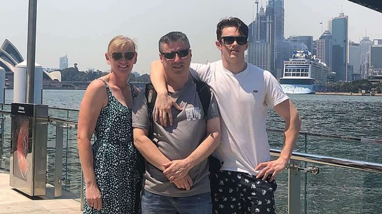 Anthony Langford (centre), his wife Kristine and son Jesse pose for a photo in Sydney before boarding the cruise.