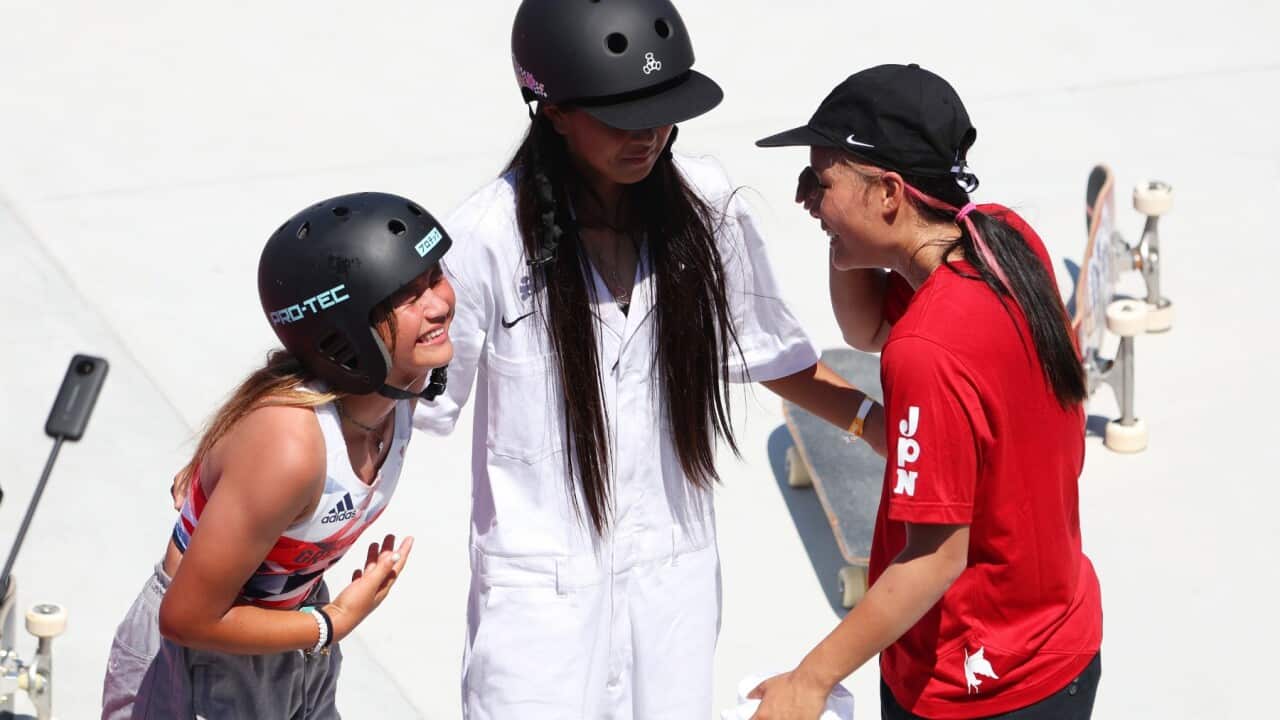 Bronze medalist Sky Brown of Team Great Britain, Gold medalist Sakura Yosozumi of Team Japan and Silver medalist Kokona Hiraki of Team Japan (center) celebrate after the Women's Skateboarding Park Finals on day twelve of the Tokyo 2020 Olympic Games at Ar