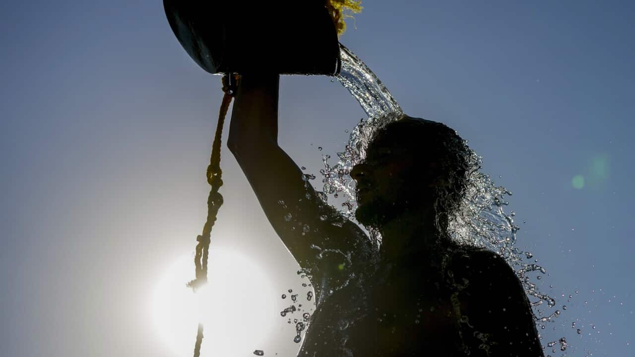 Beachgoers are seen at Bondi Beach in Sydney