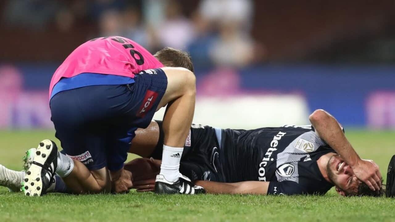 Victory midfielder Terry Antonis in agony after his injury at the SCG