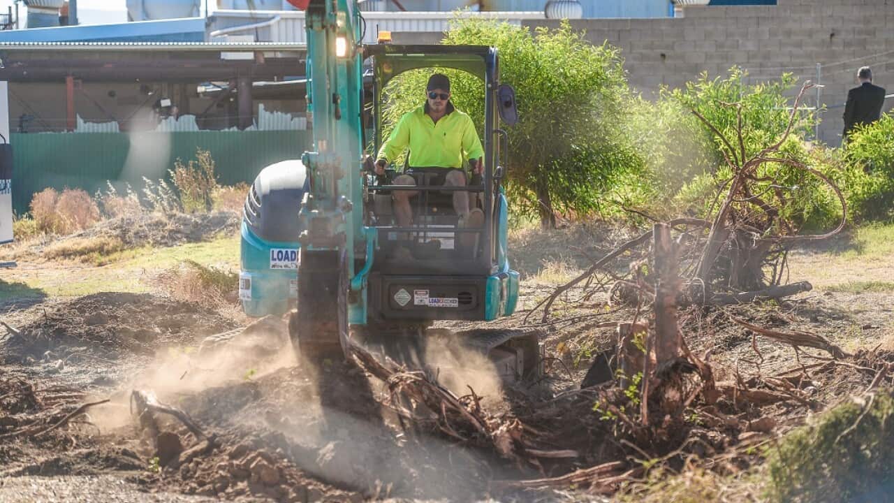 A digger moves soil at a factory in Plympton, Adelaide, Friday, February 2, 2018 in search for a fresh lead in the case of the missing Beaumont children.