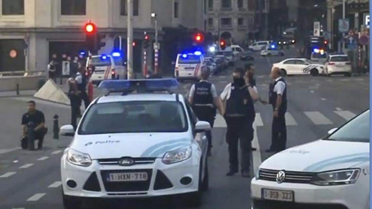 In this image taken from video, police cars block a road near the train station in central Brussels, Tuesday June 20, 2017. Belgian media report that explosion-like noises have been heard at a Brussels train station; the main square evacuated. (AP Photo)