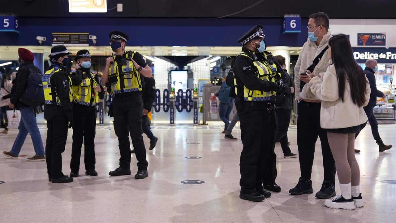 Police officers on patrol at Waterloo Station, London after new restrictions came into force