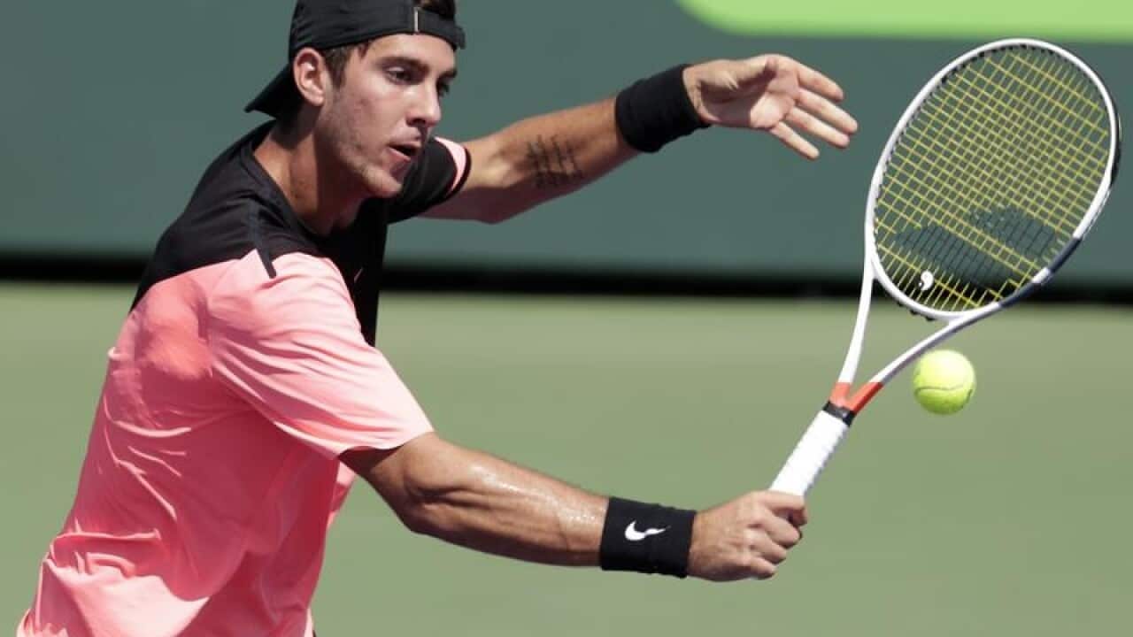 Thanasi Kokkinakis, of Australia, returns to Fernando Verdasco.