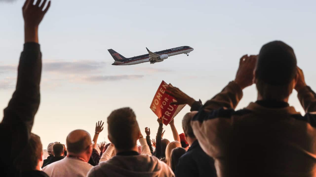 Donald Trump departs on his plane following a rally in Wilmington