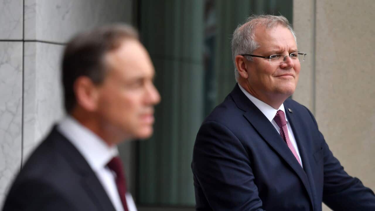 Minister for Health Greg Hunt and Prime Minister Scott Morrison announce the government's $1.1bn health and family violence package at a press conference at Parliament House in Canberra, Sunday, March 29, 2020. (AAP Image/Mick Tsikas) NO ARCHIVING