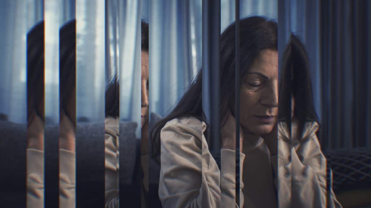 Digital composite of pensive woman sitting at home