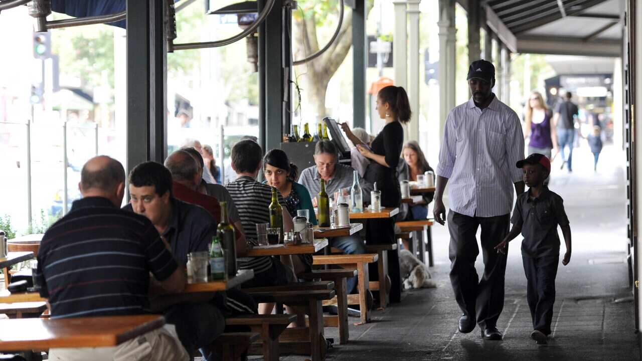 People sitting on the footpath outside cafe's in Lygon Street, Melbourne, Australia, on February 29, 2012, Australia.(AP Photo/Mal Fairclough)