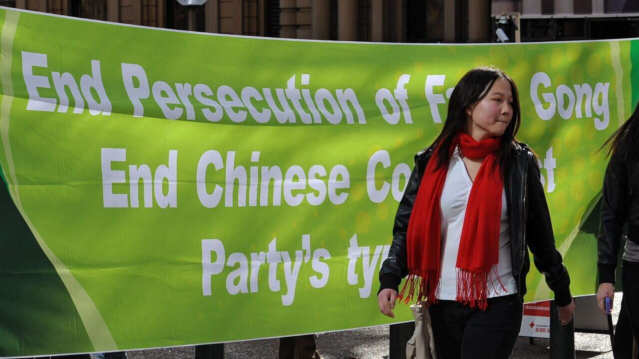 A banner at a protest in Sydney by members of Falan Dafa, also known as Falungong - AAP.jpg