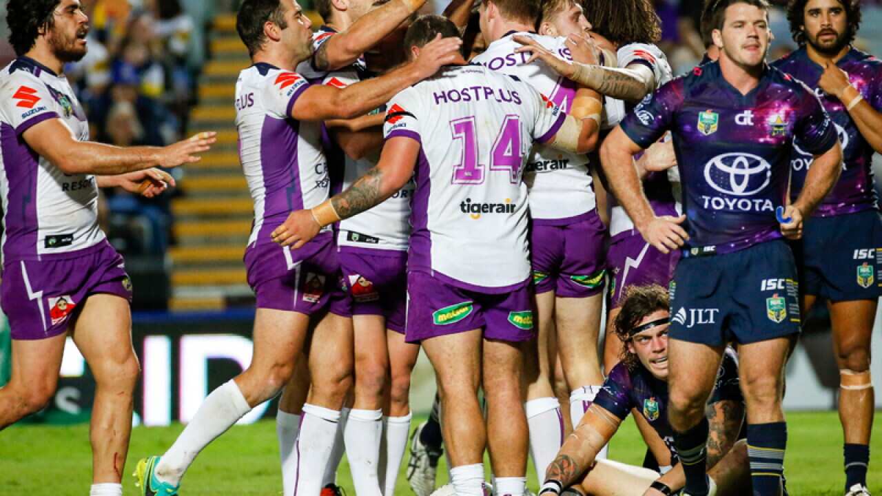 Tim Glasby of the Storm is congratulated by team mates