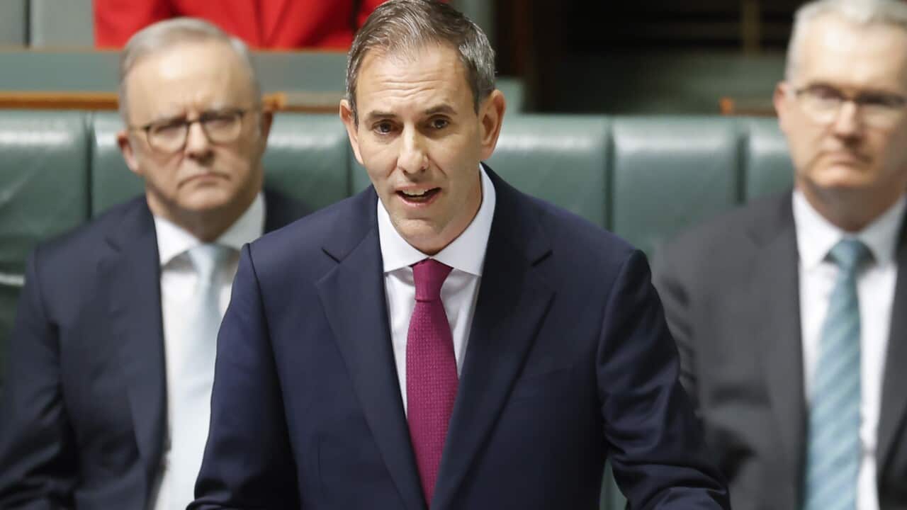Treasurer Jim Chalmers speaking while standing at a lectern as he delivers the 2026 federal budget.