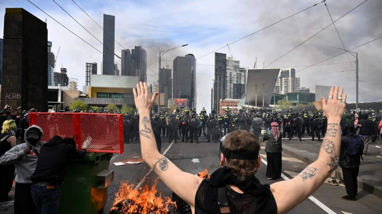 Police clash with protesters during a rally against the Land Forces Expo in Melbourne (AAP).jpg