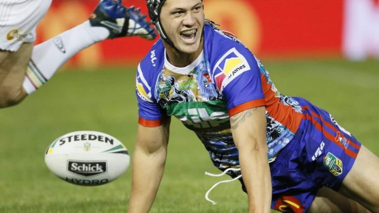 Kalyn Ponga of the Knights scores a try.