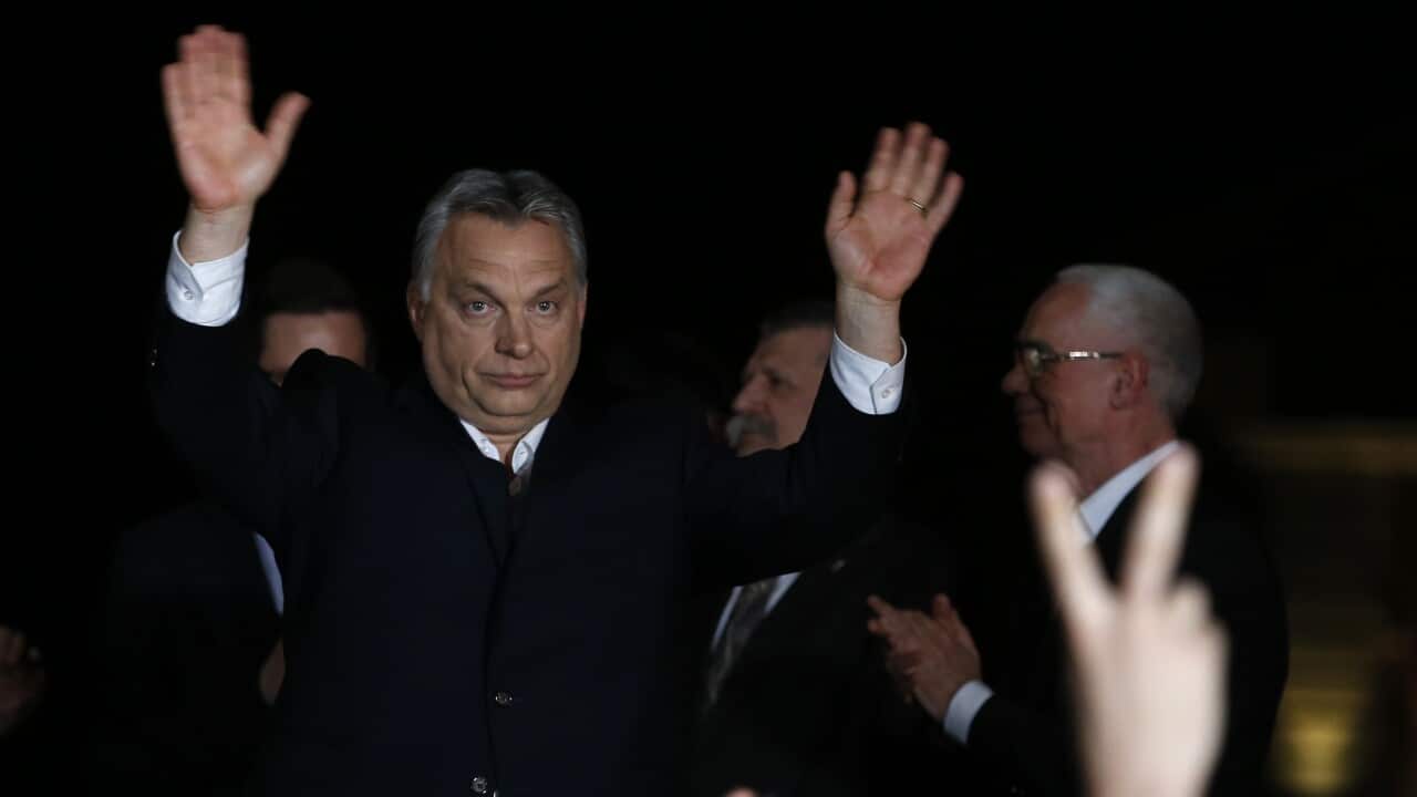 Hungarian Prime Minister Viktor Orban greets his supporters in Budapest, Hungary, Sunday, April 8, 2018.