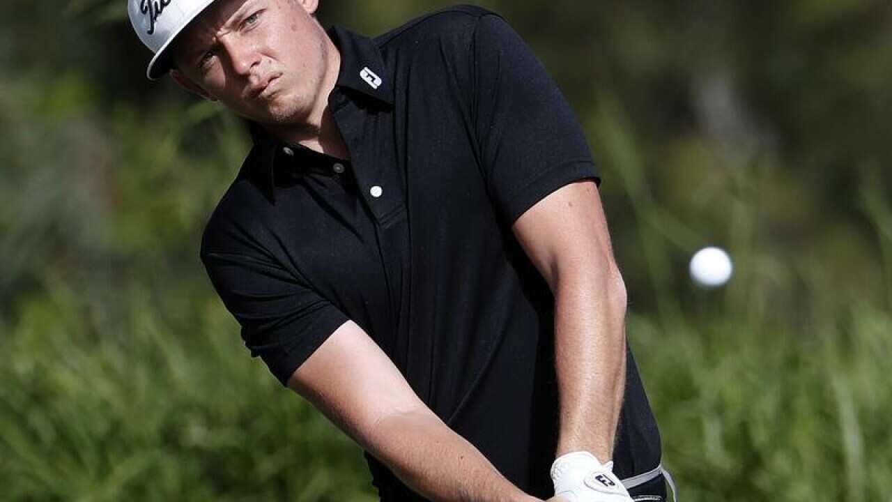 Cameron Smith hits onto the fourth green