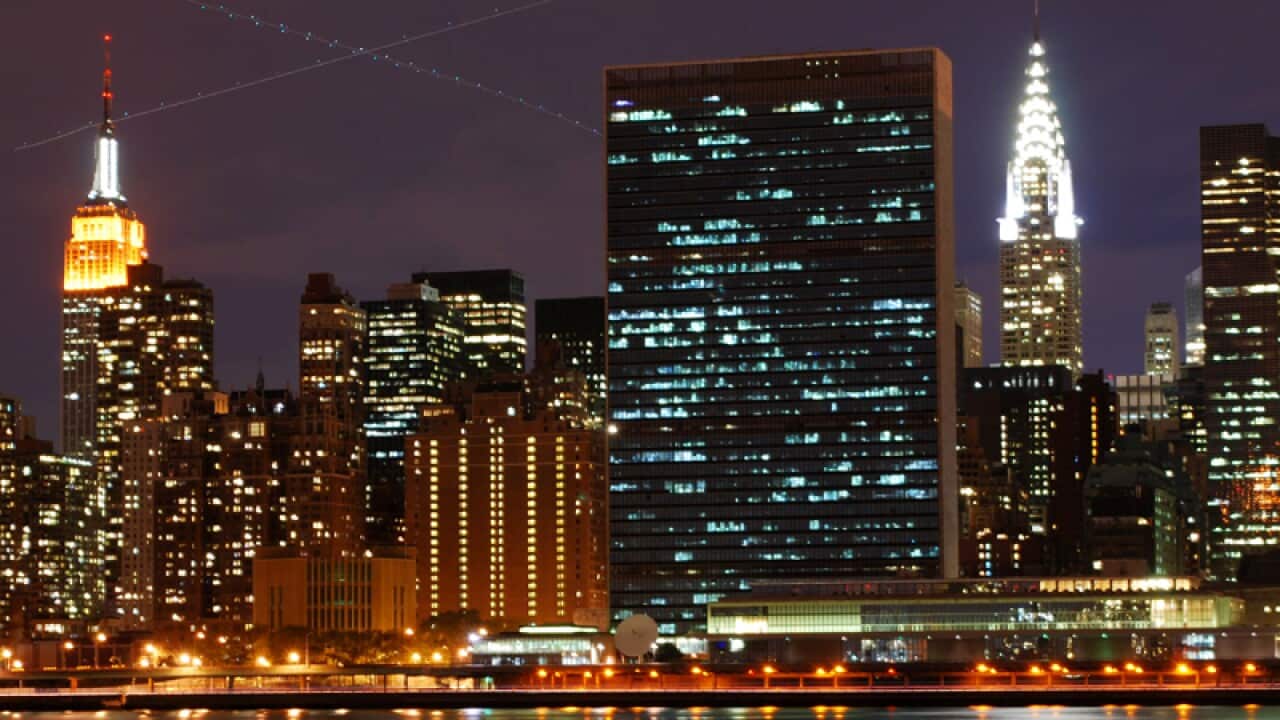 A night time view across the East River to the UN building.
