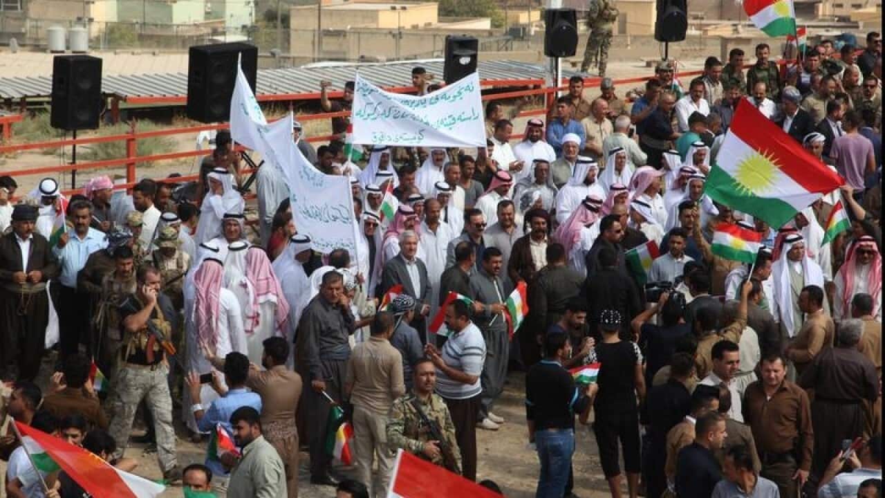 Iraqi Kurds take part in a rally to support independence.