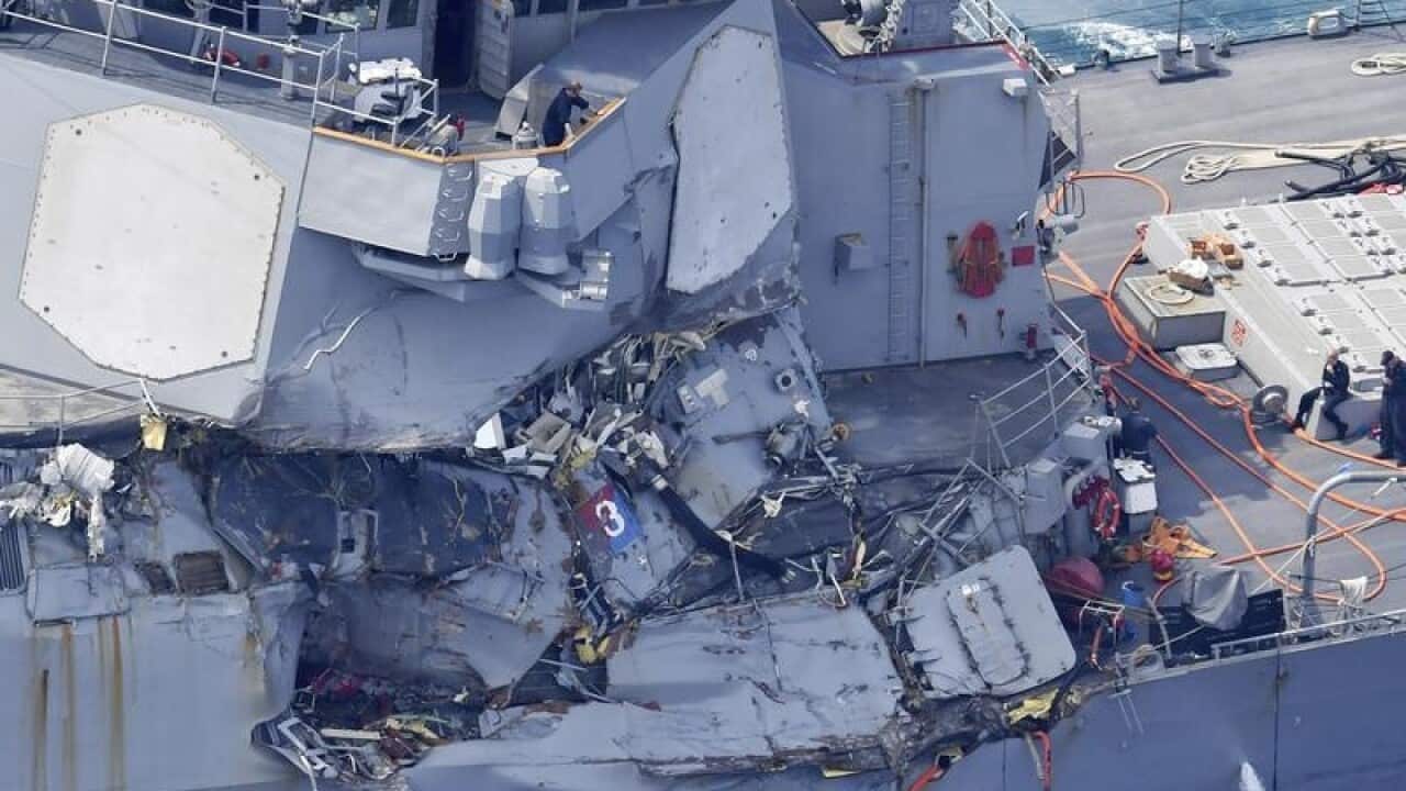 A photo shows the USS Fitzgerald that is damaged by the collision