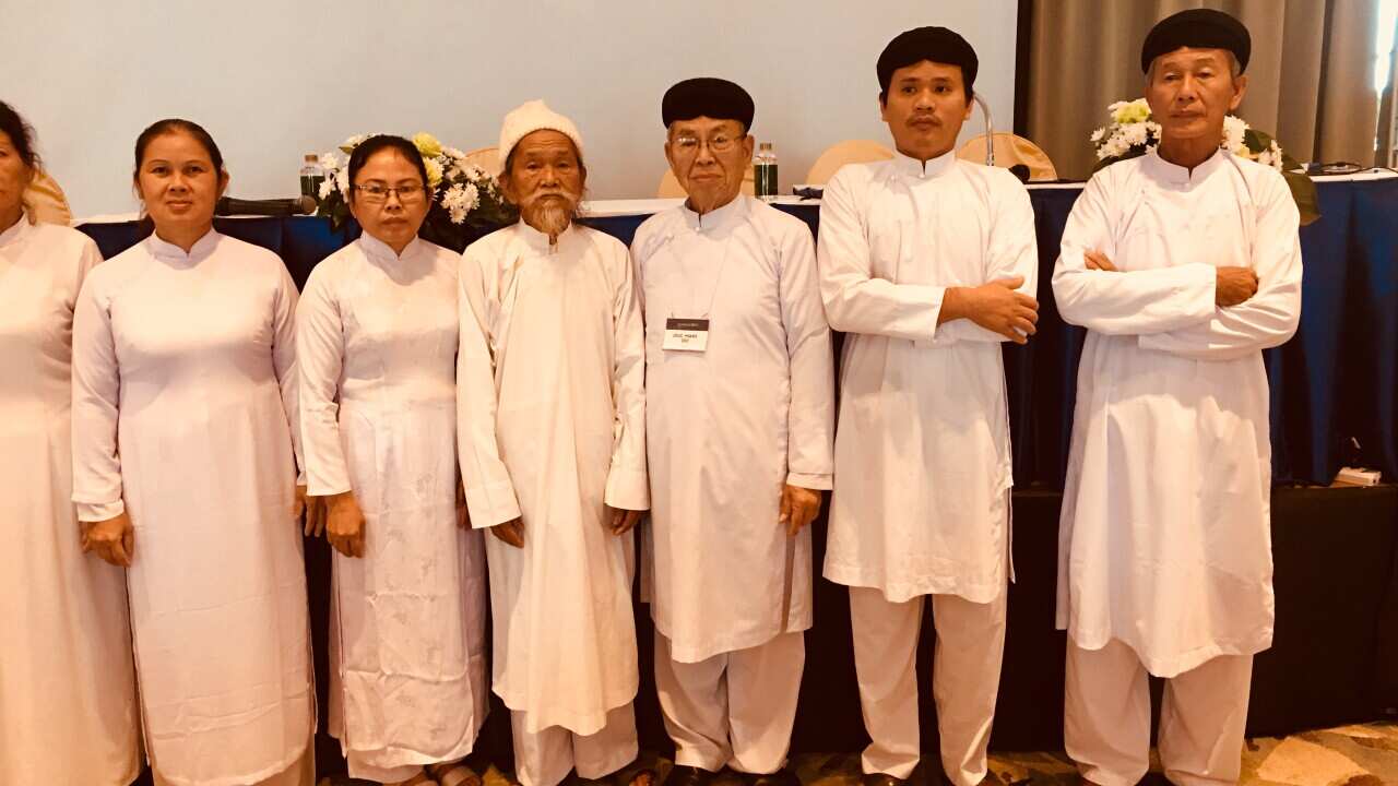 Mr Do Minh Duc with black turban and wears glasses with a Caodai delegation in Washington