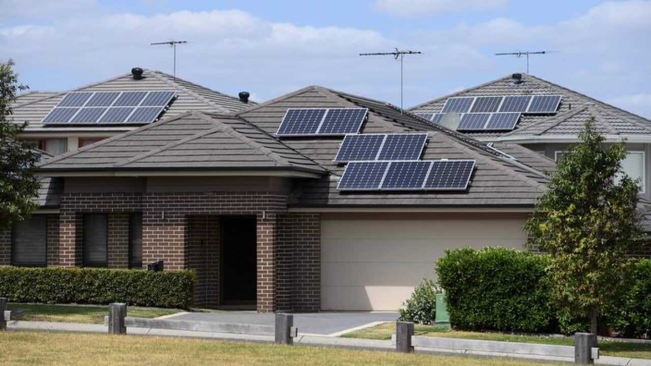 Solar panels are seen on the rooftops of houses in The Ponds, North West of Sydney, Tuesday, October 17, 2017. (AAP Image/Dan Himbrechts) NO ARCHIVING