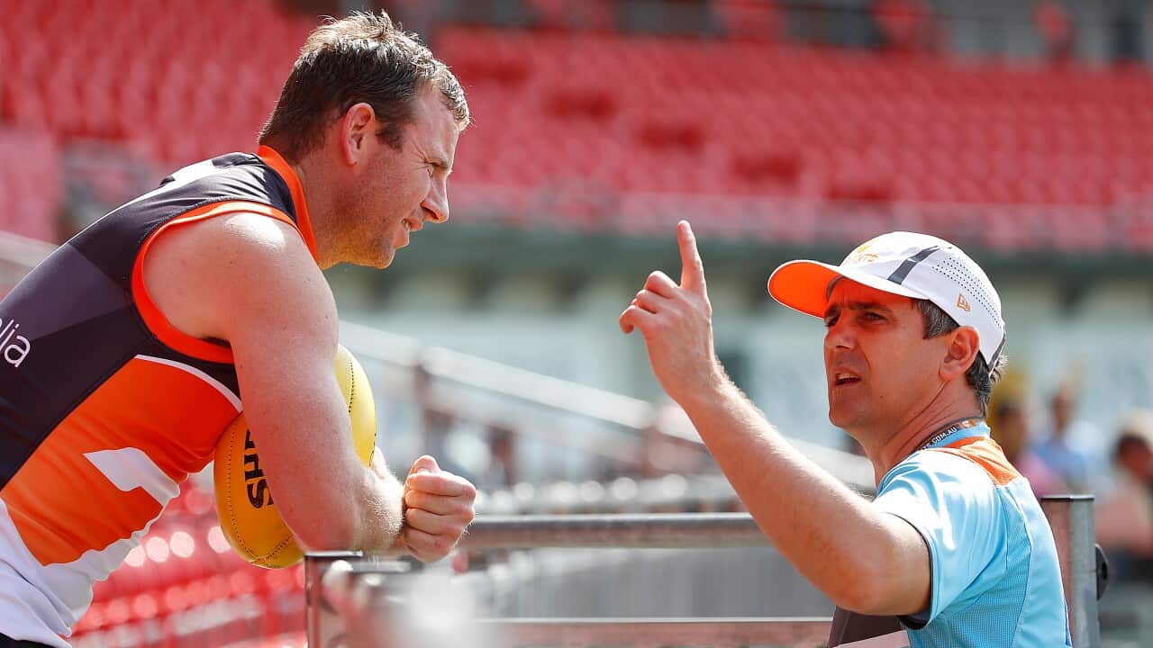 Steve Johnson, left, and Giants coach Leon Cameron (AAP)