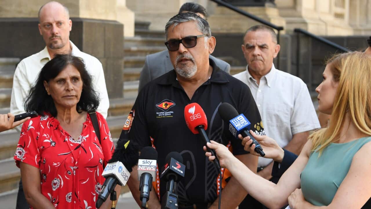 Darren Lovett (third right), the uncle of Tommy Lovett speaks to media outside of the Victorian State Parliament, Melbourne, Tuesday, January 22, 2019. Tommy Lovett is the victim of a police brutality incident that occurred on April 5, 2016.