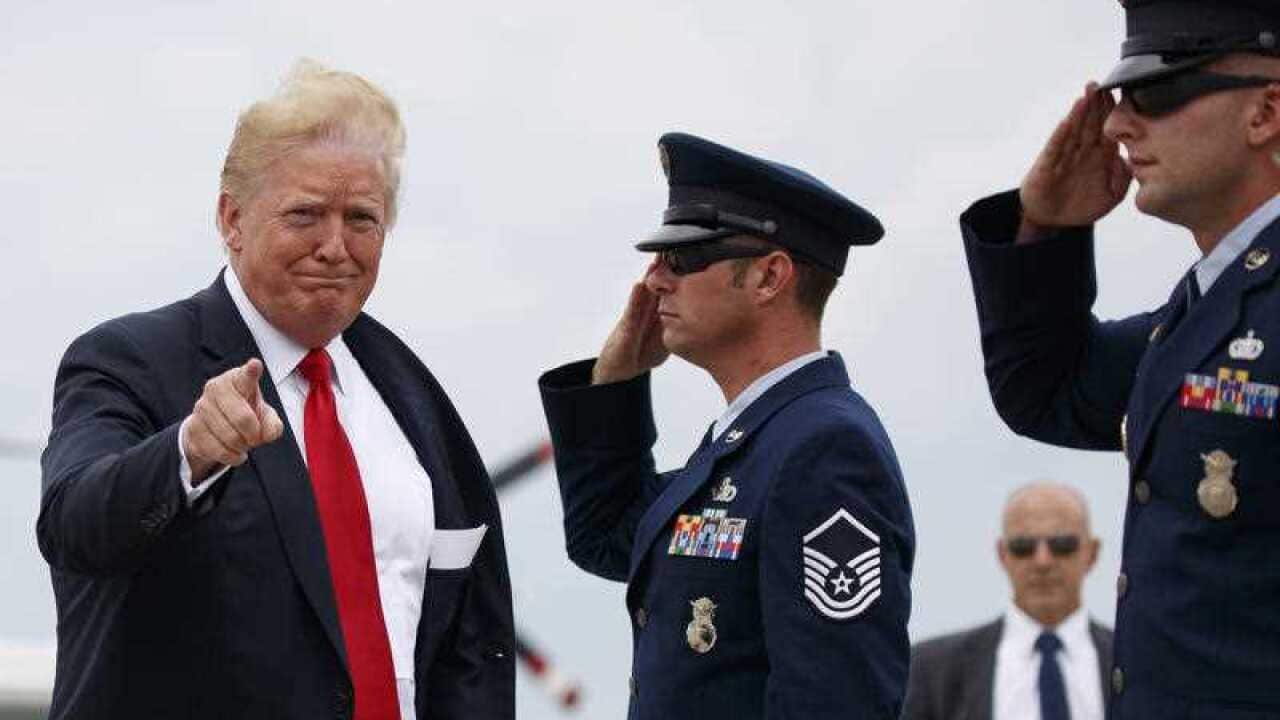 President Donald Trump points as he boards Air Force One, Friday, July 27, 2018, in Andrews Air Force Base, Md., en route to Morristown Municipal Airport, in Morristown, N.J.