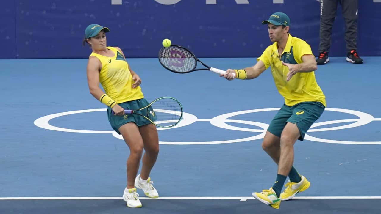 The Australian doubles team of Ashleigh Barty, left, and John Peers play during a semifinals match of the tennis competition at the 2020 Summer Olympics, Friday, July 30, 2021, in Tokyo, Japan. (AP Photo/Seth Wenig)