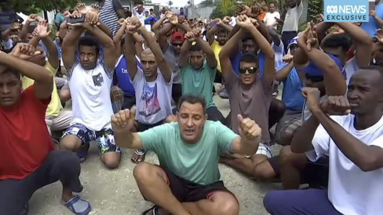 n this file photo made from Australia Broadcasting Coporation video made on Tuesday, Oct. 31, 2017, asylum seekers protesting the possible closure of their detention center, on Manus Island, Papua New Guinea.