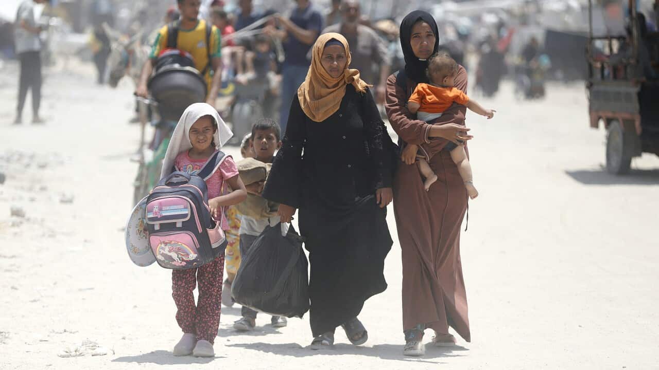People flee from the eastern districts of the southern Gaza Strip city of Khan Younis, on July 22, 2024