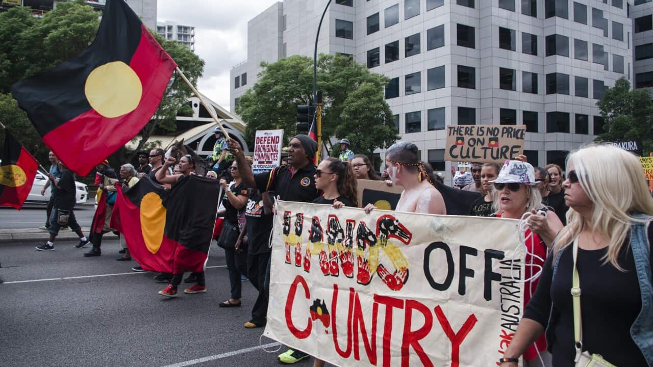 Hundreds of protesters march to parliament in the Perth CBD to rally against the state government's planned closure of more than 100 remote communities. (AAP)