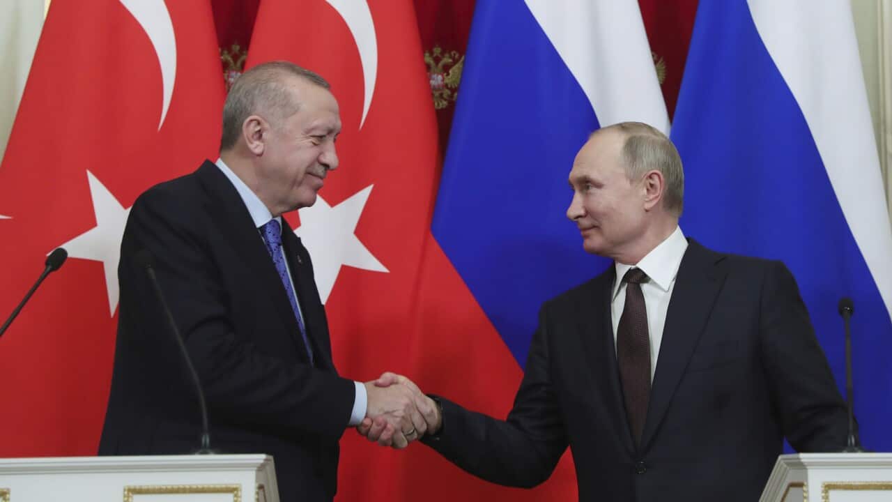 Russia's President Vladimir Putin, right, and Turkish President Recep Tayyip Erdogan shake hands after a joint news conference followed six-hour talks in the Kremlin, in Moscow, Russia, Thursday, March 5, 2020. (Presidential Press Service via AP, Pool)