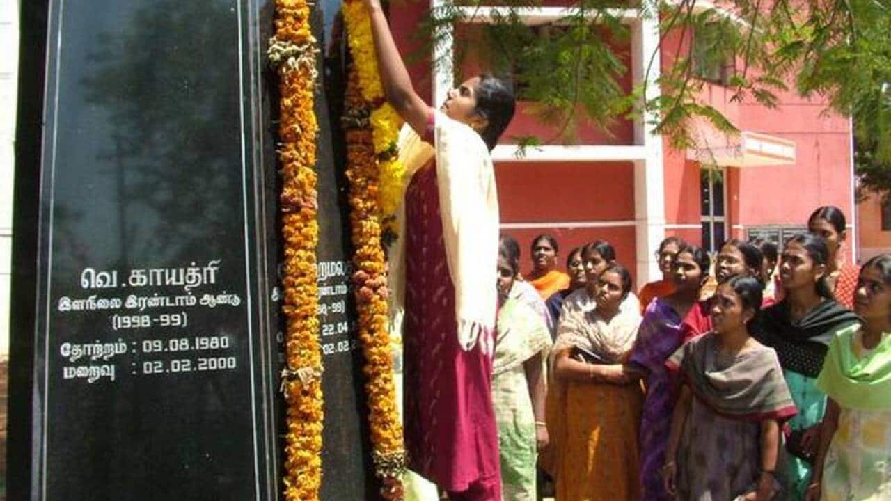 Photo of students paying homage to the three girls who died in the bus burning incident, at Tamil Nadu Agricultural University in Coimbatore.