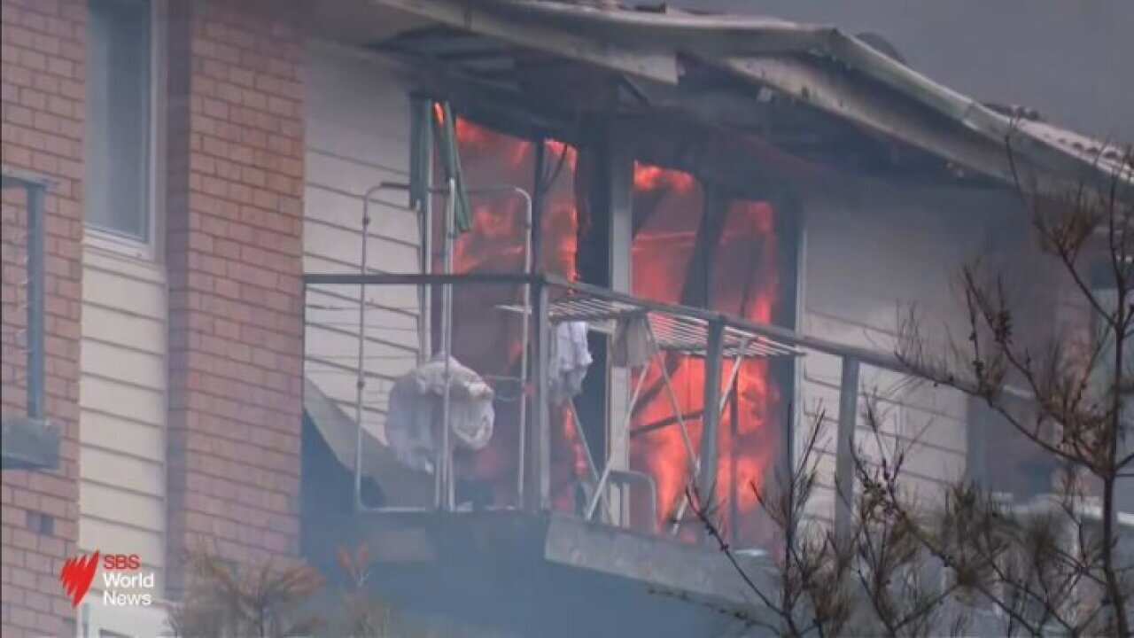 Firefighter dies in NSW as fire fronts ease