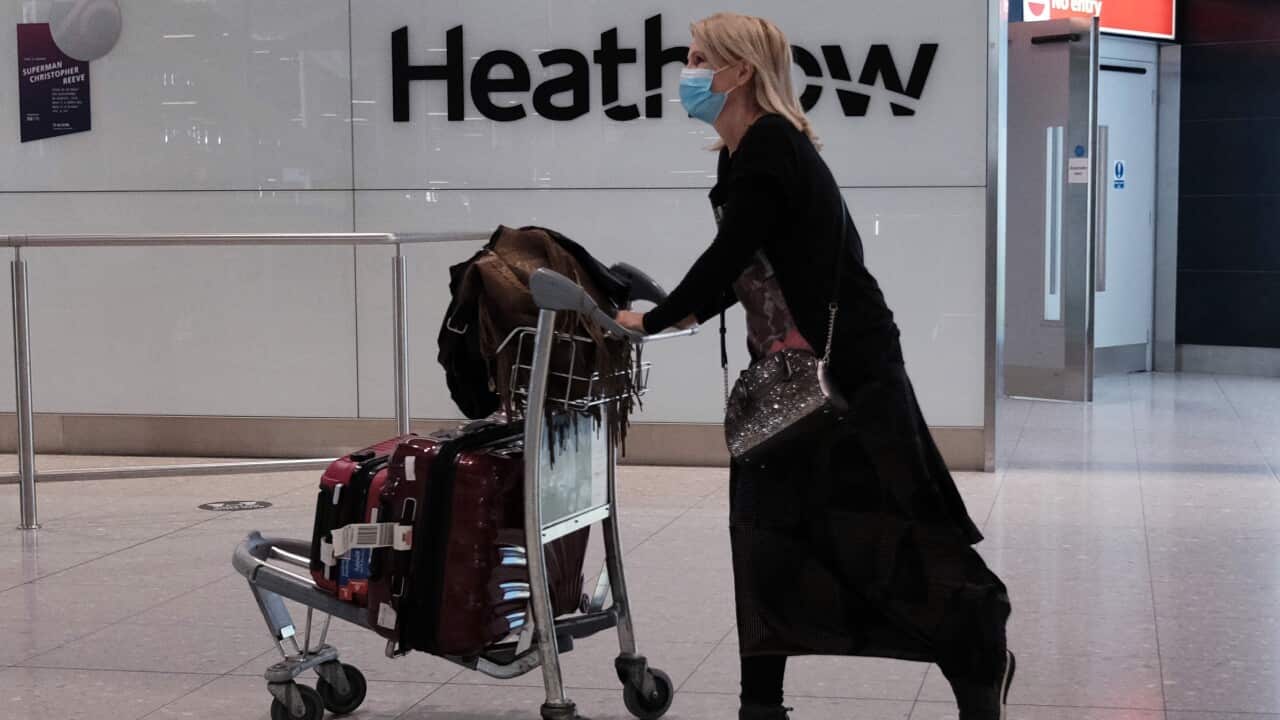 Passengers arrive back in the UK at Heathrow Airport.