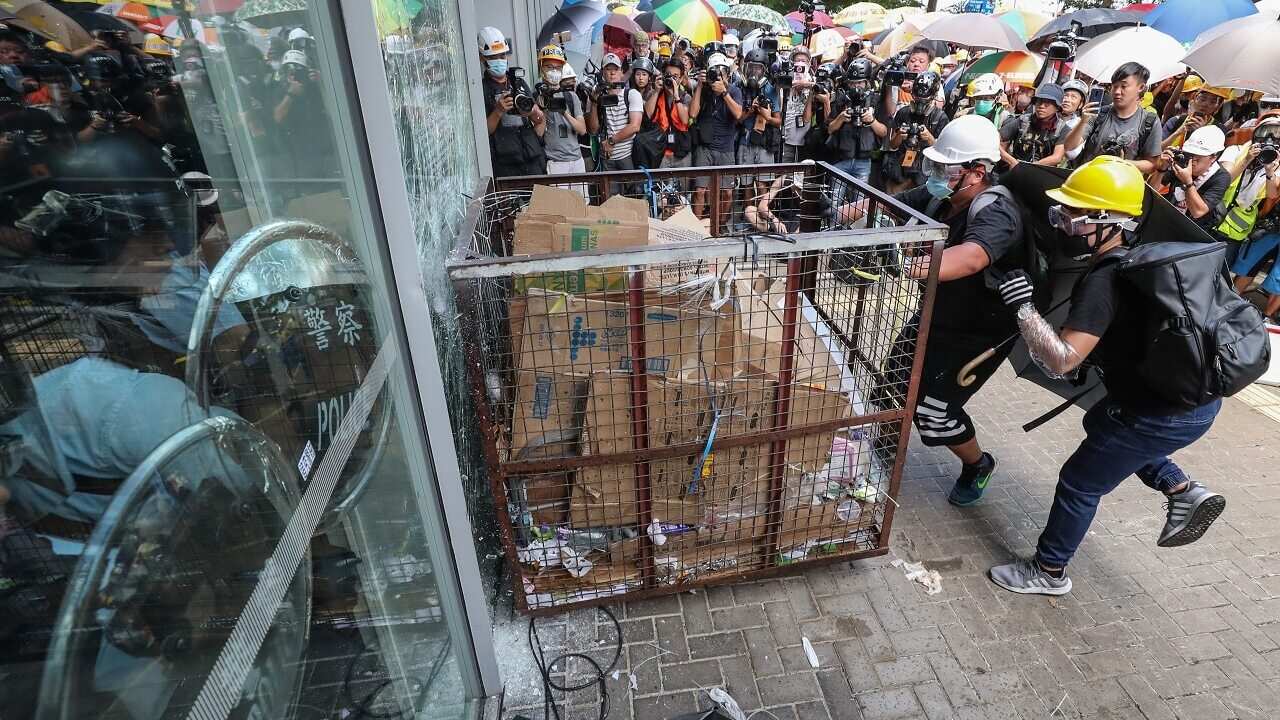 Protesters smash window of the Legislative Council in Hong Kong.
