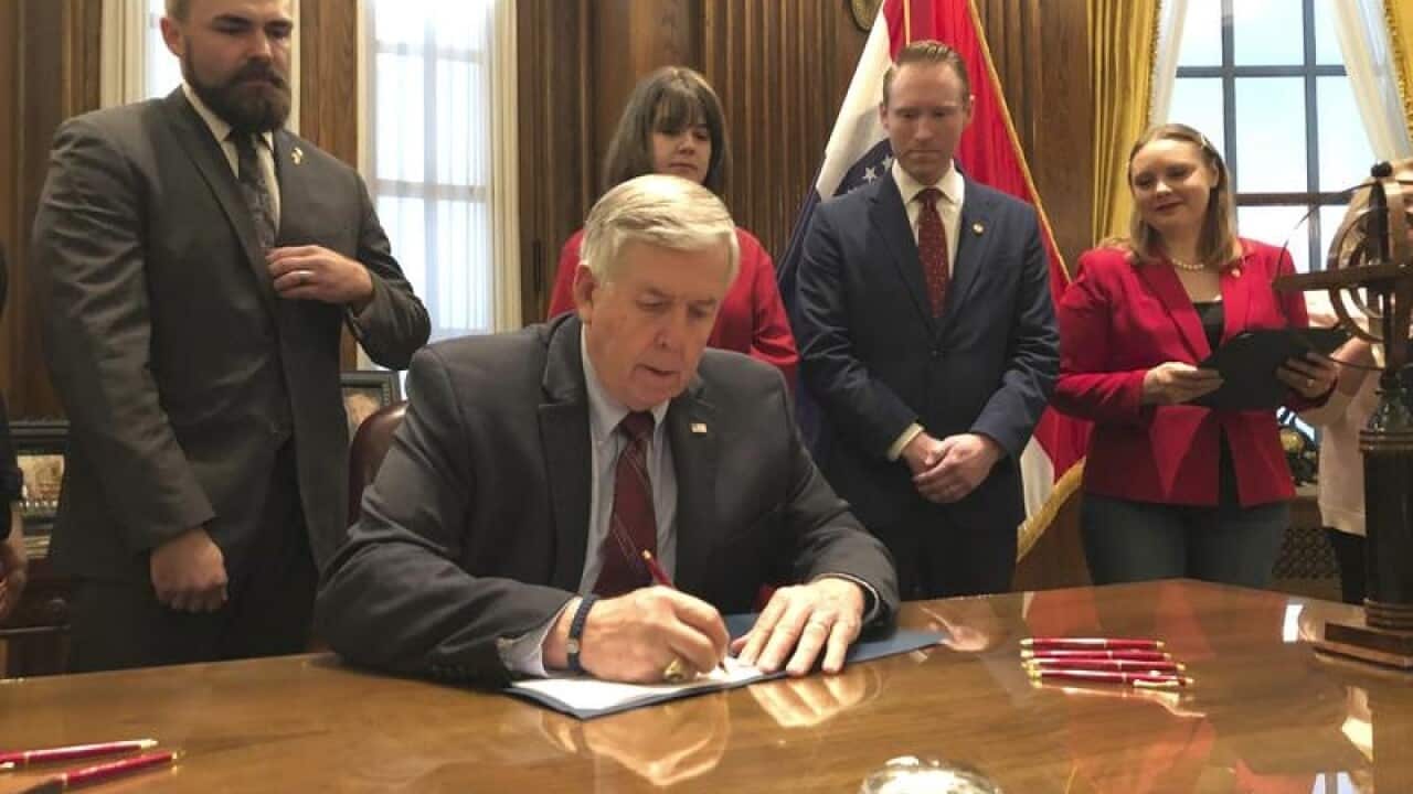 Missouri Governor Mike Parson signs the abortion bill