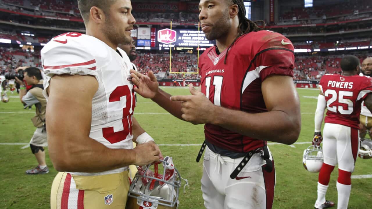 Arizona's Larry Fitzgerald (R) and San Francisco's Jarryd Hayne