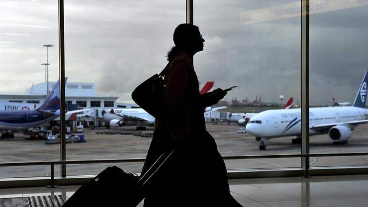 Tourists at the international airport in Sydney.