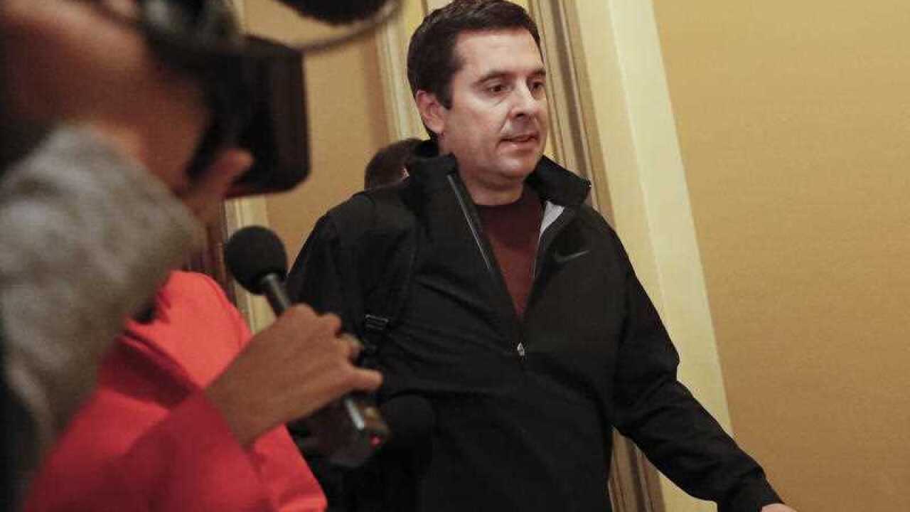 House Intelligence Committee Chairman Rep. Devin Nunes, R-Calif. is pursued by reporters as he leaves Capitol Hill in Washington
