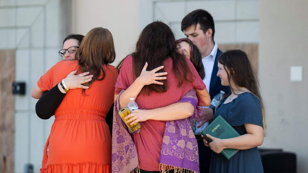 People are reunited at Trillium NCG Theatre with friends and family who were present during a nearby shooting