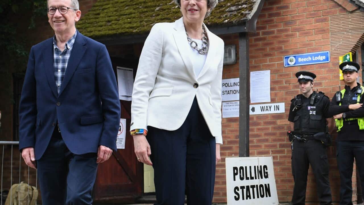 Theresa May and her husband Philip leave after casting their votes