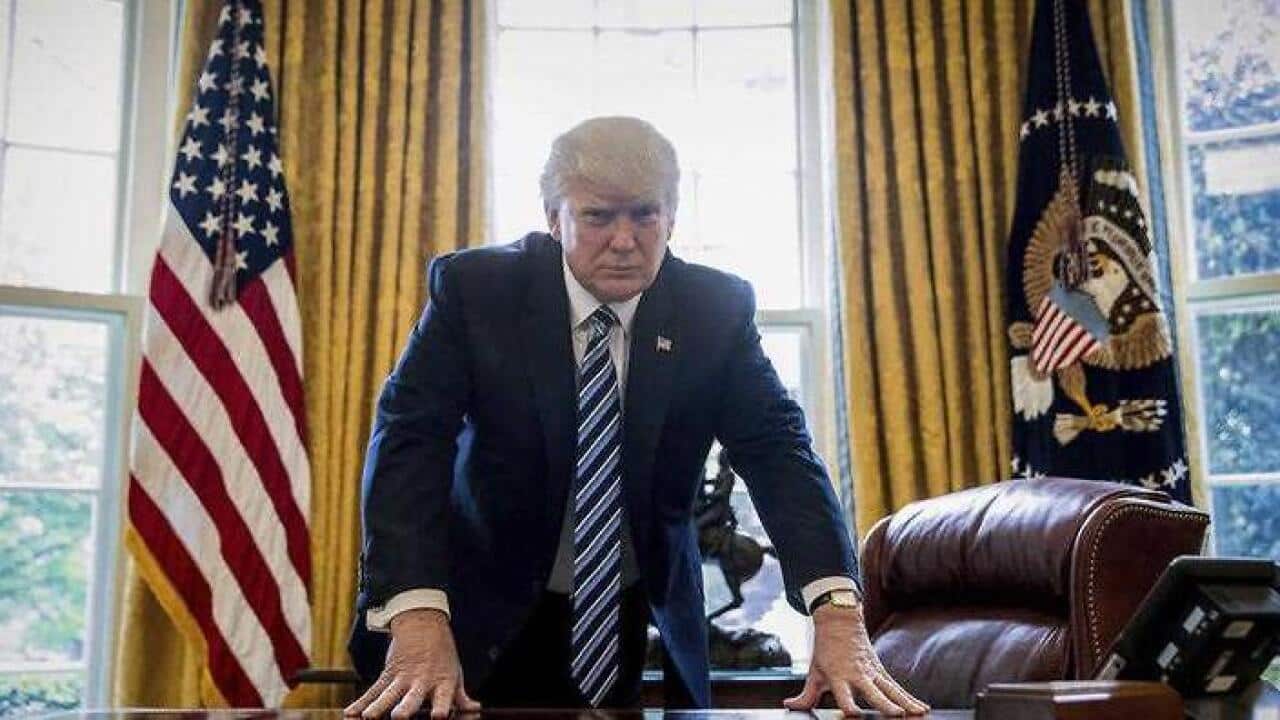 In this April 21, 2017, file photo, President Donald Trump poses for a portrait in the Oval Office in Washington after an interview with The Associated Press.
