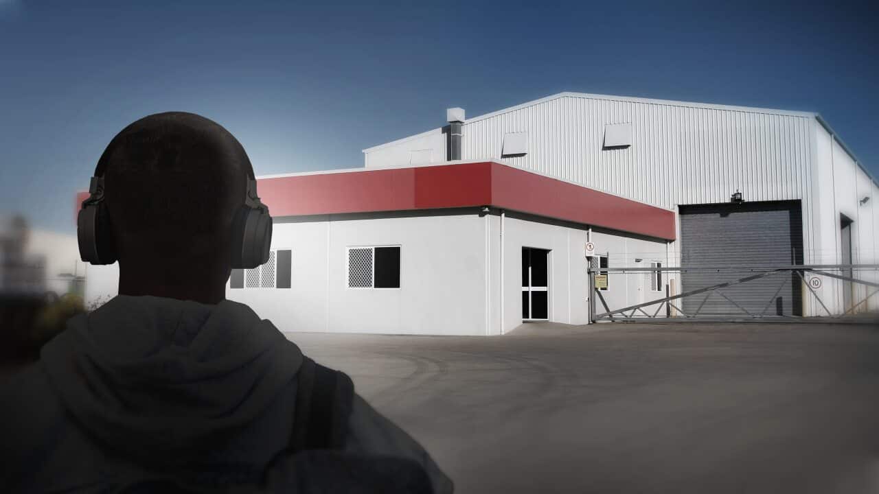 Artistic impression of story: Person in front of abattoir type building