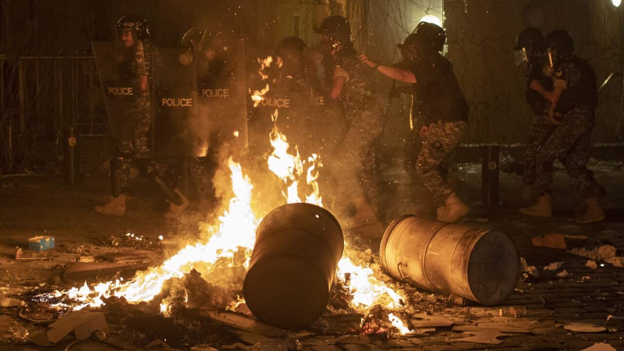 Riot police advance to push back anti-government protesters in Beirut, Lebanon