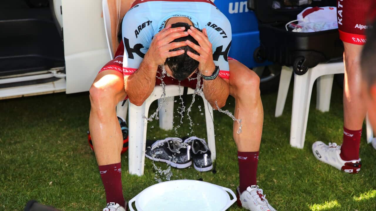 Getty Image of Aussie Nathan Haas bathing himself in water in a bid to stay cool at last year's Tour Down Under