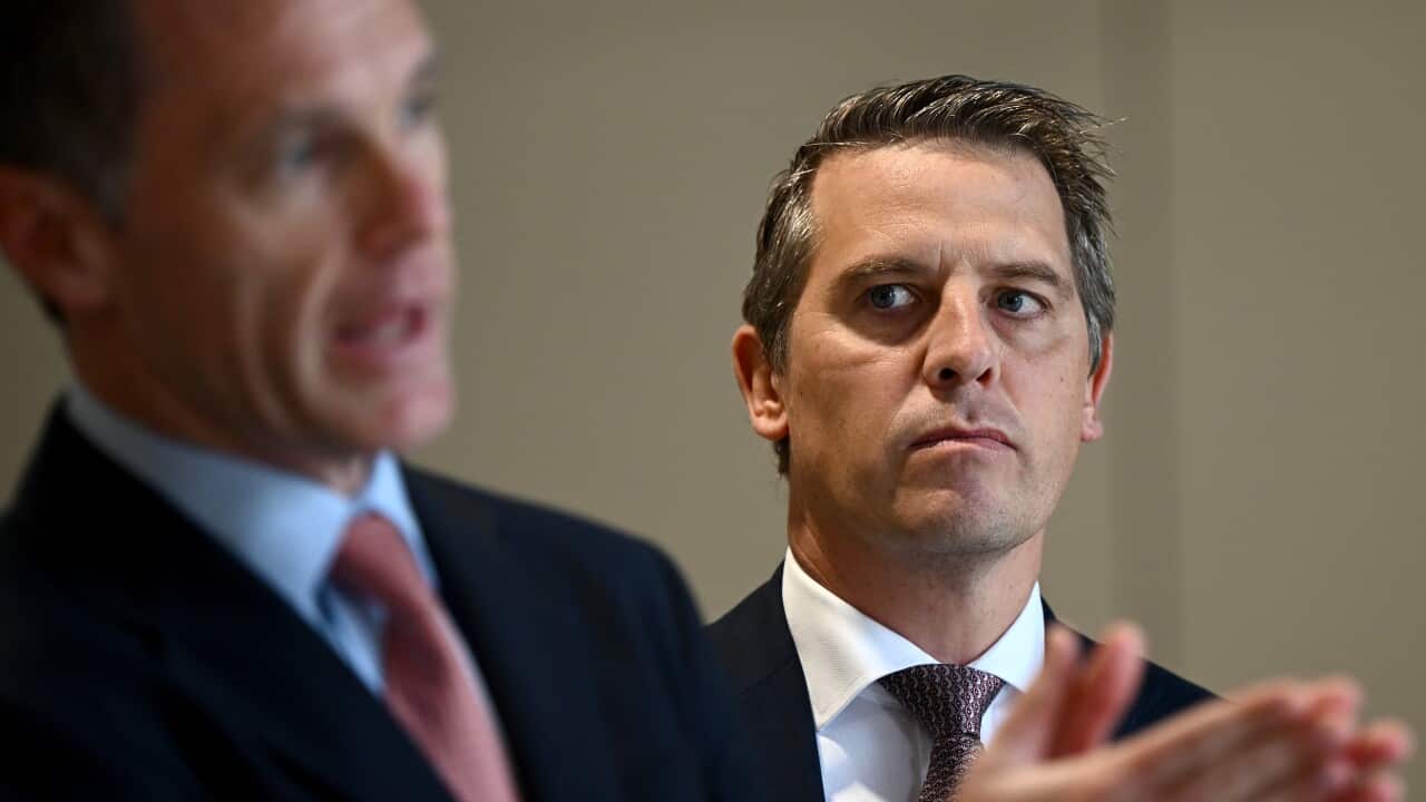 Two men wearing suits